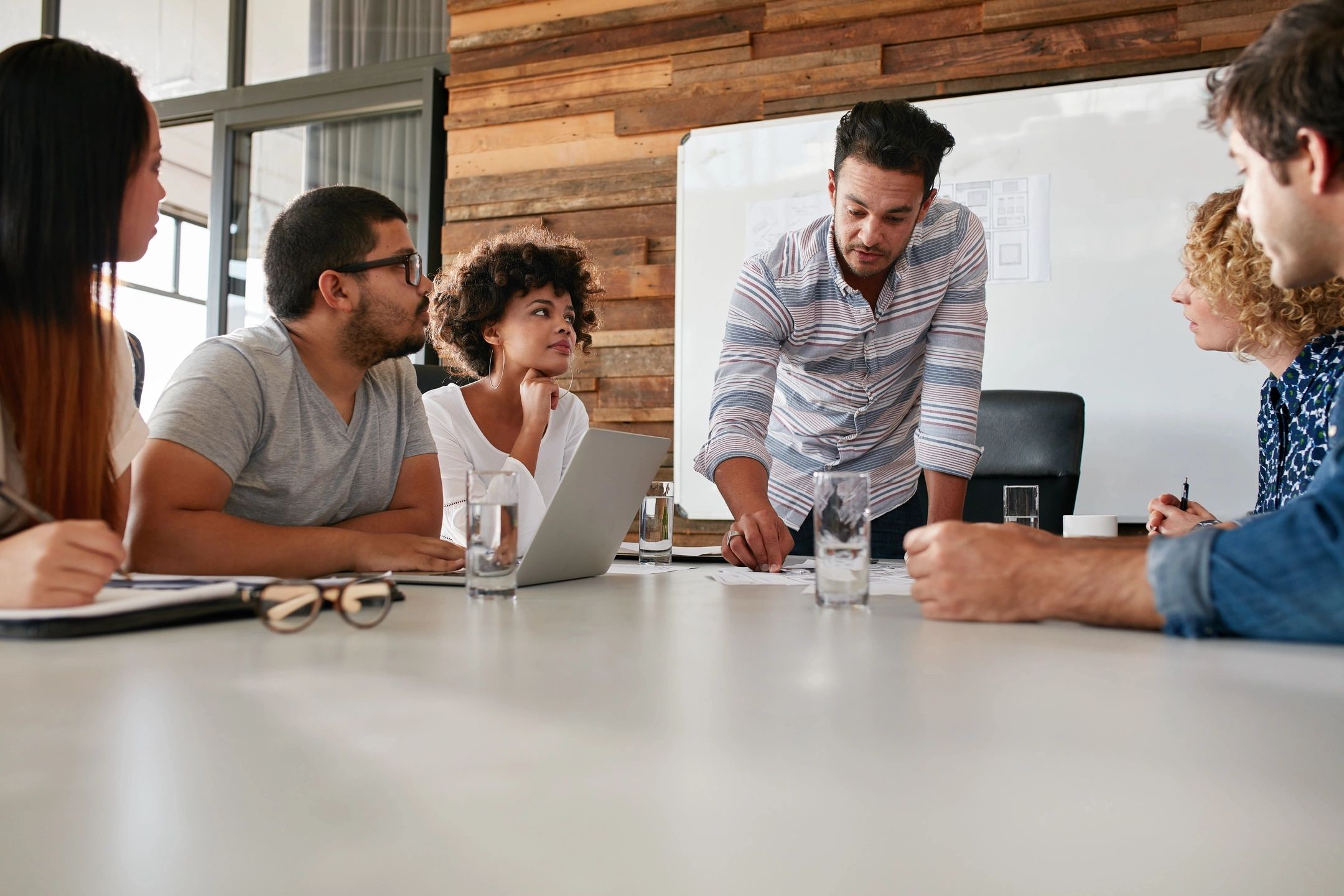 team discussing business at a conference table.